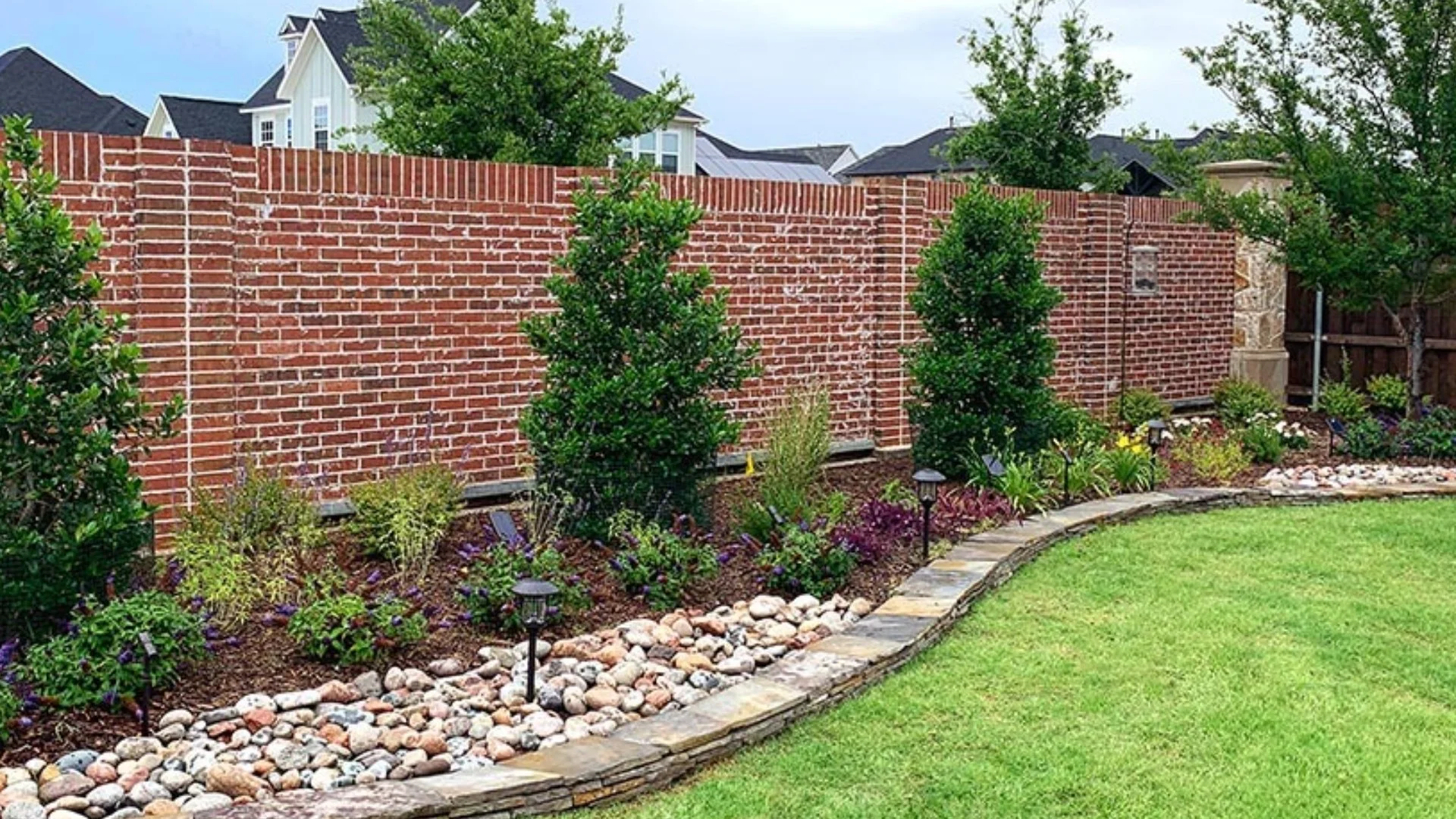 Beautiful landscape beds filled with plants and trees in Parker, TX.