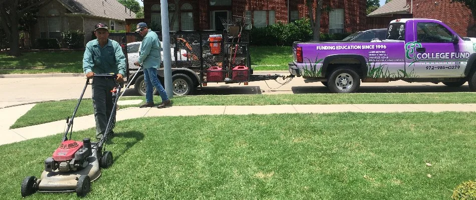 Crew mowing grass near sidewalk in Lucas, TX.