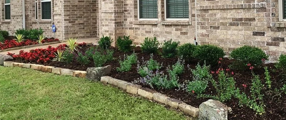 Flower bed installation on property in Plano, TX.