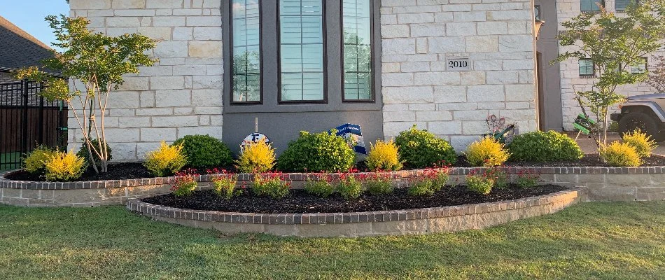 Landscape beds in Plano, TX, with mulch.