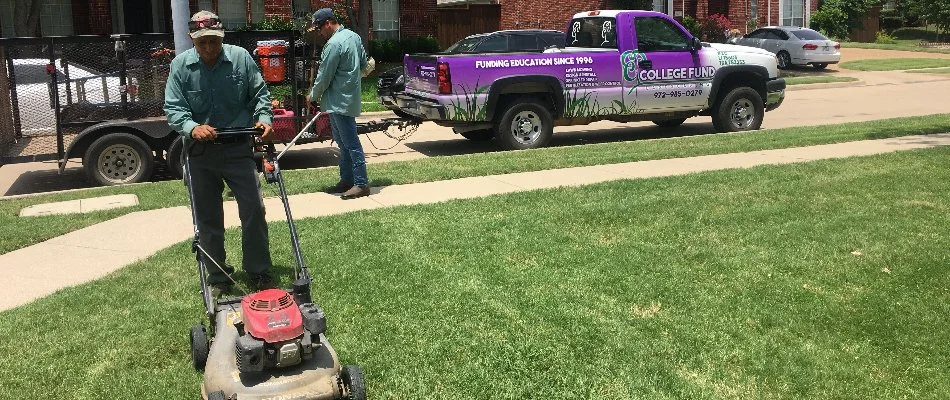 Workers mowing and edging a lawn in Wylie, TX.